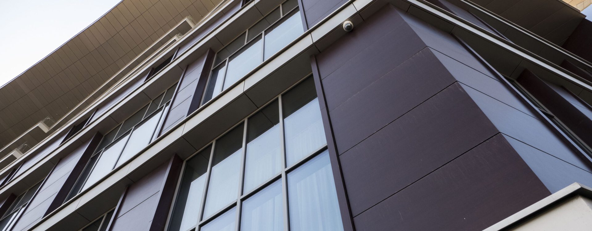 facade of a residential building fragment low angle view against the sky.